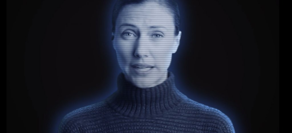 Robotul "Antonia" din Primăria Cluj, ajutat de un funcţionar public - hologramă