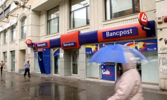 Bancpost intră în istorie. Șefii Băncii Transilvania se uită spre noi achiziții