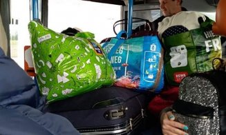 Români întorși din Germania, înghesuiţi într-un autocar spre Cluj