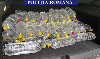 Percheziţii la Cluj într-un dosar de contrabandă. Polițiștii au confiscat sute de litri de alcool și zeci de mii de țigări