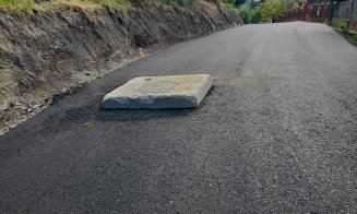 Cum au asfaltat drumul în Dezmir: Gură de canal urcată pe "soclu"