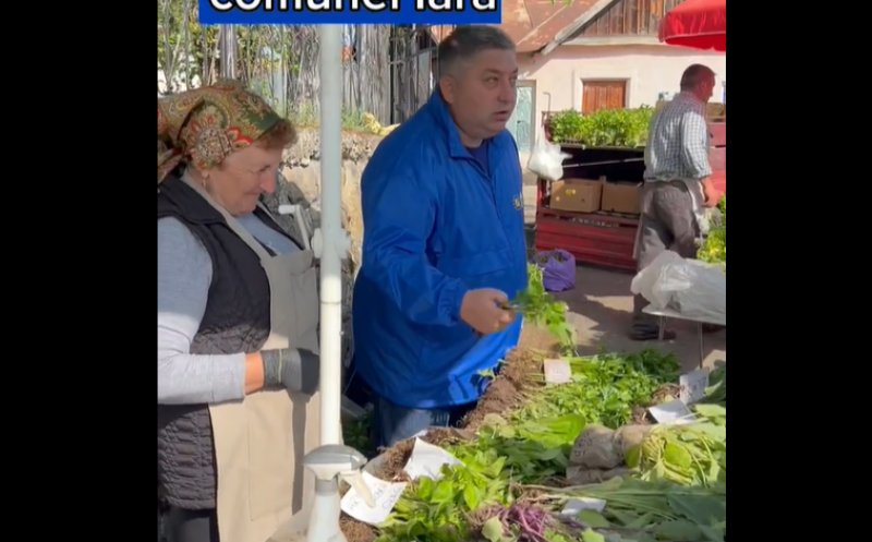 Alin Tișe, la târgul din comuna Iara. A ajutat o bătrânică să-și vândă produsele