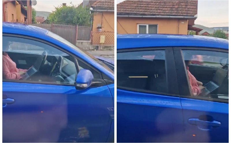 Șoferiță din Cluj, surprinsă în timp ce butonează laptopul la volan